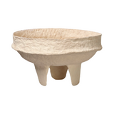 Beige ceramic bowl with three legs on a white background