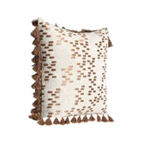Decorative pillow with brown tassels on a white background