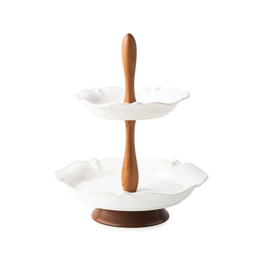 Two-tiered ceramic serving tray with wooden handle on a white background