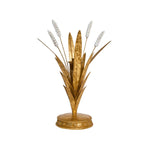 Decorative gold plant sculpture with white flowers on a white background