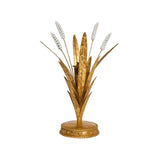 Decorative gold plant sculpture with white flowers on a white background