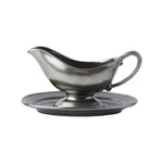 Gray gravy boat with matching saucer on a white background