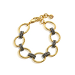 Gold and gray chain bracelet on a white background