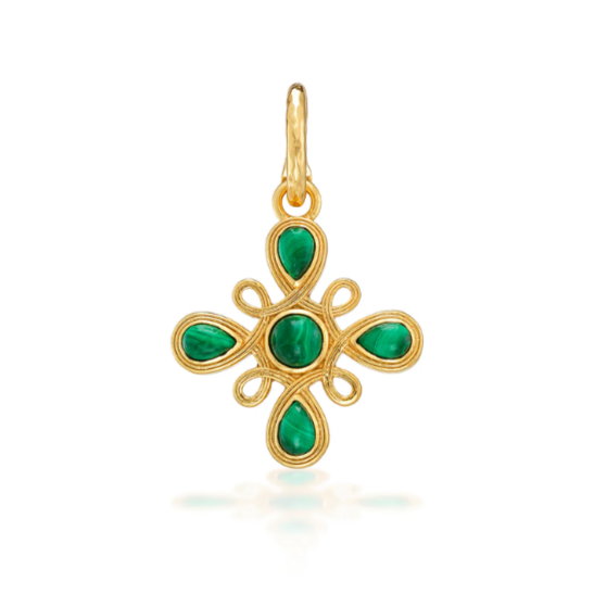 Gold pendant with green gemstones on a white background