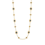 Gold necklace with blue gemstones on a white background