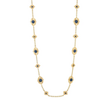 Gold necklace with blue gemstones on a white background