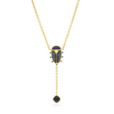 Gold necklace with a blue pendant on a white background