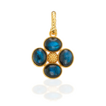 Gold pendant with blue stones on a white background