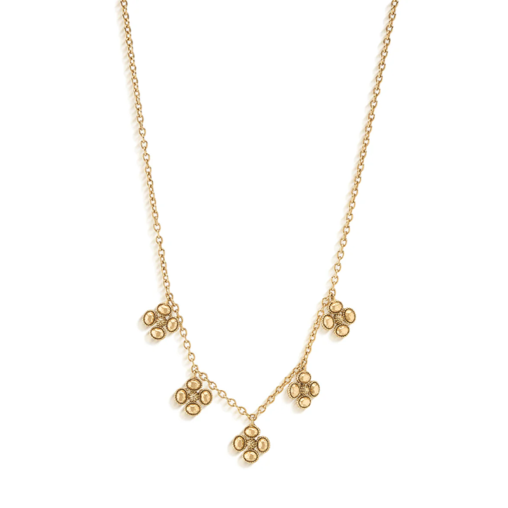 Gold necklace with floral pendants on a white background