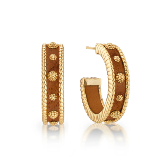 Gold hoop earrings with brown enameled design on a white background