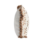 Decorative wall piece with tassels on a white background
